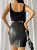 Black imitation leather skirt with decorative chain